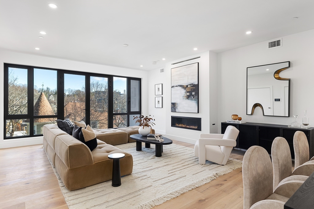 41 University Road, Unit 2 Brookline, MA 02445 - Photo 2 of 33 a living room with furniture and a large window