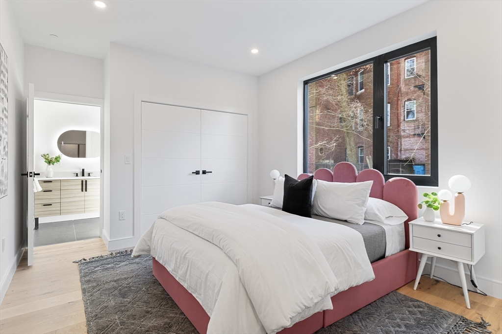 41 University Road, Unit 2 Brookline, MA 02445 - Photo 25 of 33 a bedroom with a large bed and a large window