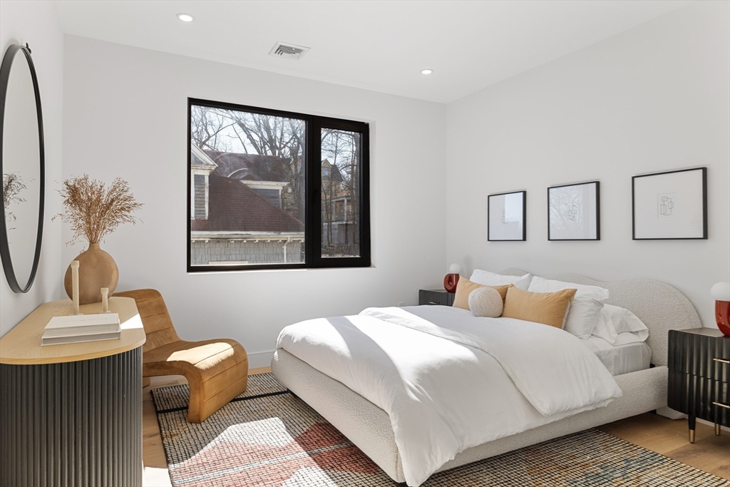41 University Road, Unit 2 Brookline, MA 02445 - Photo 28 of 33 a bedroom with a bed and a window