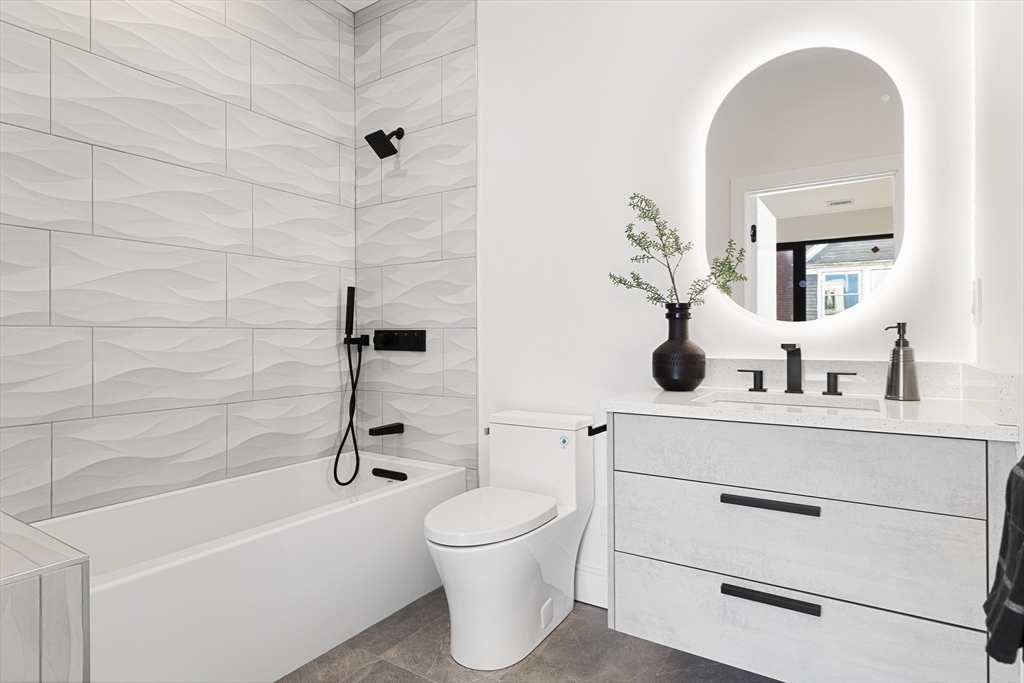 41 University Road, Unit 2 Brookline, MA 02445 - Photo 30 of 33 a bathroom with a toilet a sink and bathtub