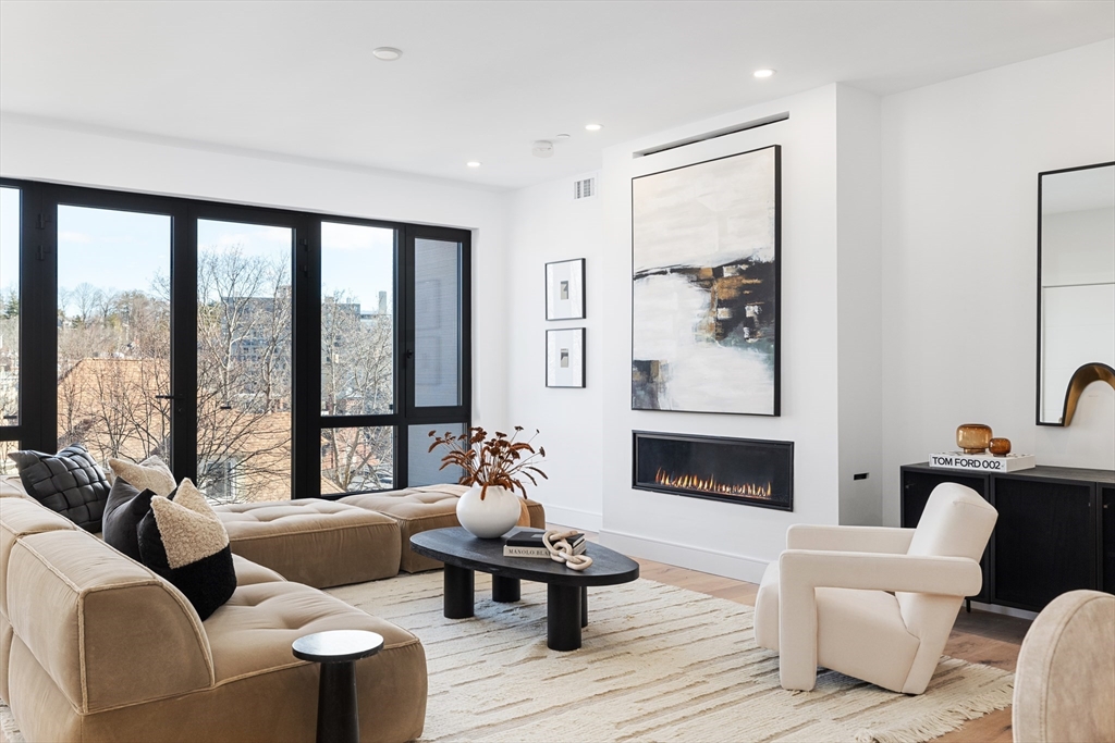 41 University Road, Unit 2 Brookline, MA 02445 - Photo 3 of 33 a living room with furniture and a large window