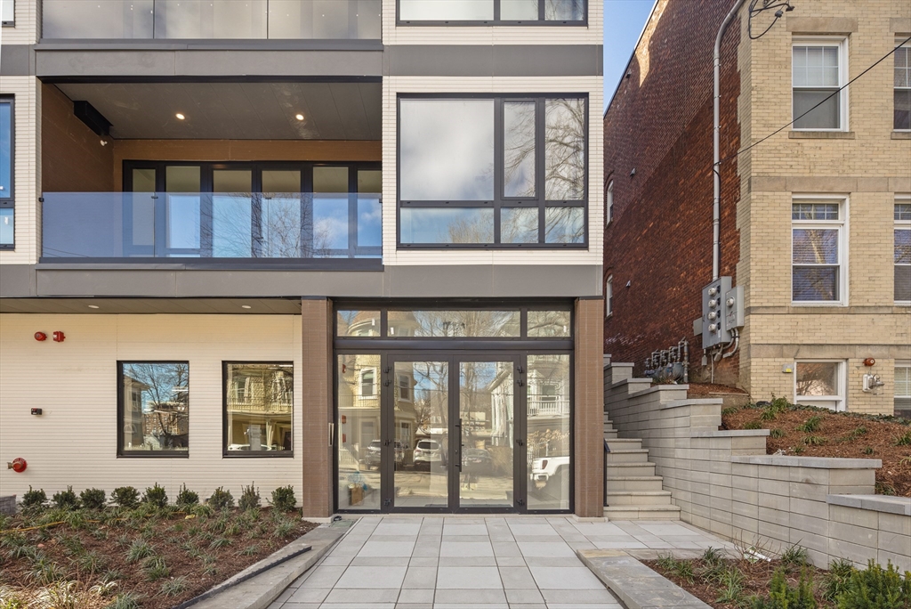41 University Road, Unit 2 Brookline, MA 02445 - Photo 33 of 33 a front view of a brick building with many windows