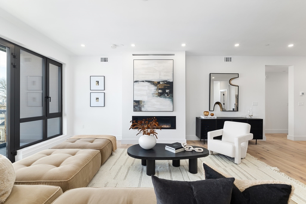 41 University Road, Unit 2 Brookline, MA 02445 - Photo 4 of 33 a living room with furniture and window