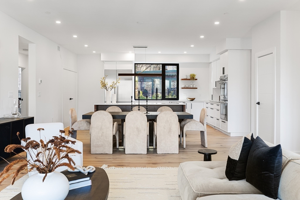41 University Road, Unit 2 Brookline, MA 02445 - Photo 6 of 33 a living room with furniture and a large window