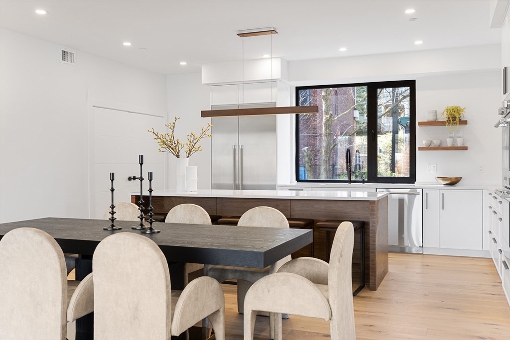 41 University Road, Unit 2 Brookline, MA 02445 - Photo 8 of 33 a dining room with furniture and window