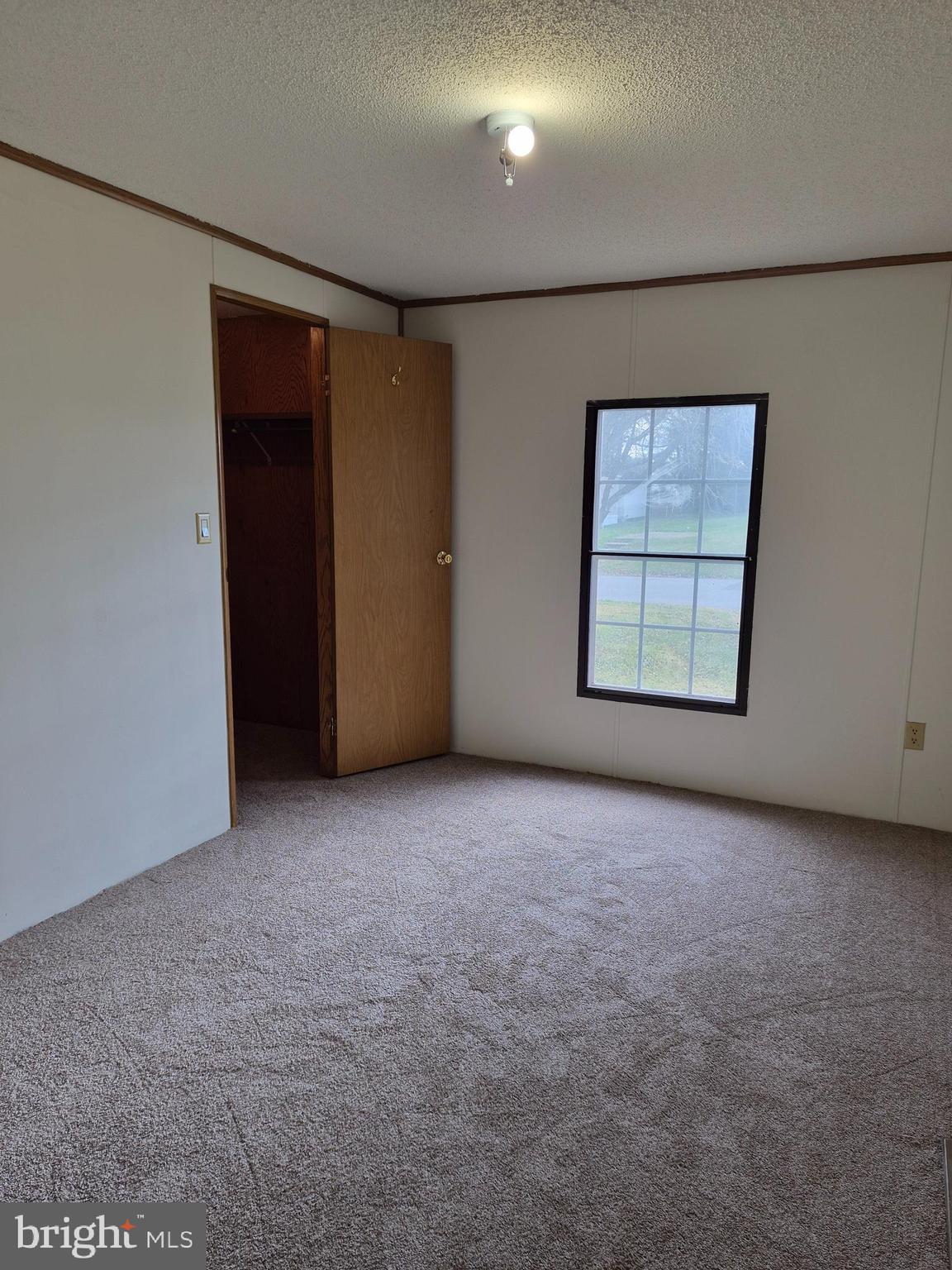 707 Cleaver Farm Road, Unit 707 Middletown, DE 19709 - Photo 12 of 15 an empty room with windows and closet