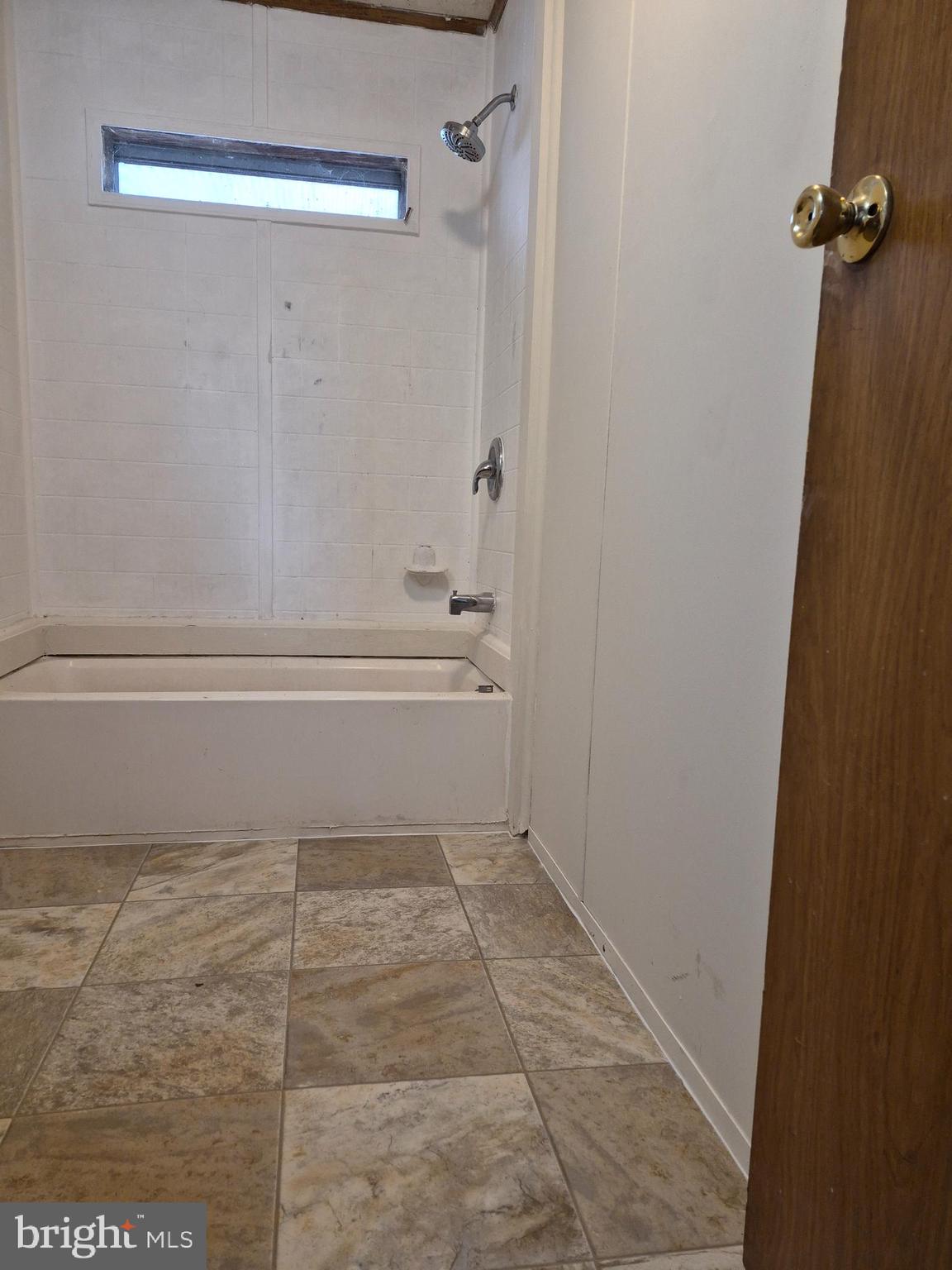 707 Cleaver Farm Road, Unit 707 Middletown, DE 19709 - Photo 13 of 15 a bathroom with a bathtub