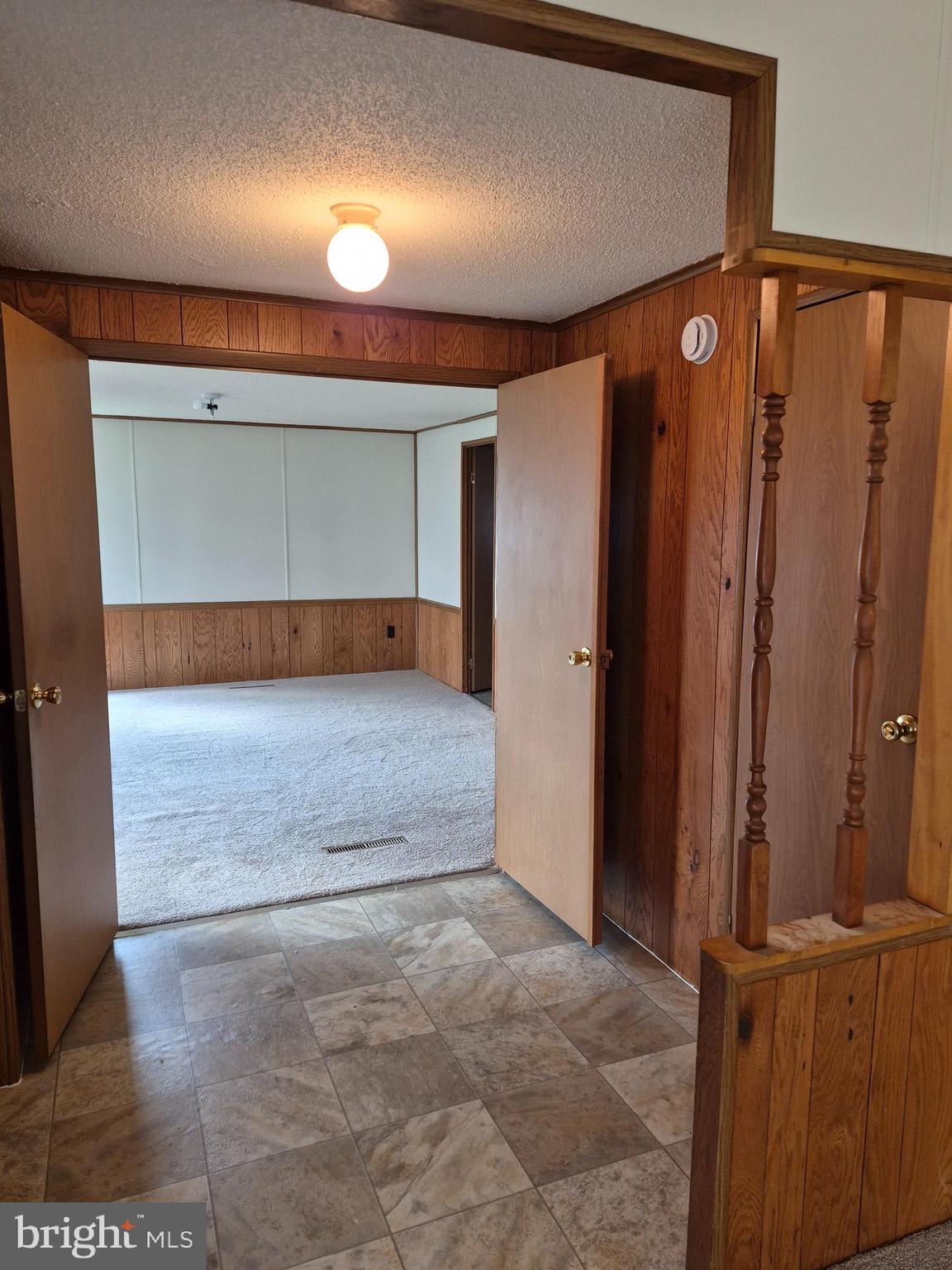 707 Cleaver Farm Road, Unit 707 Middletown, DE 19709 - Photo 4 of 15 a view of a hallway with wooden floor