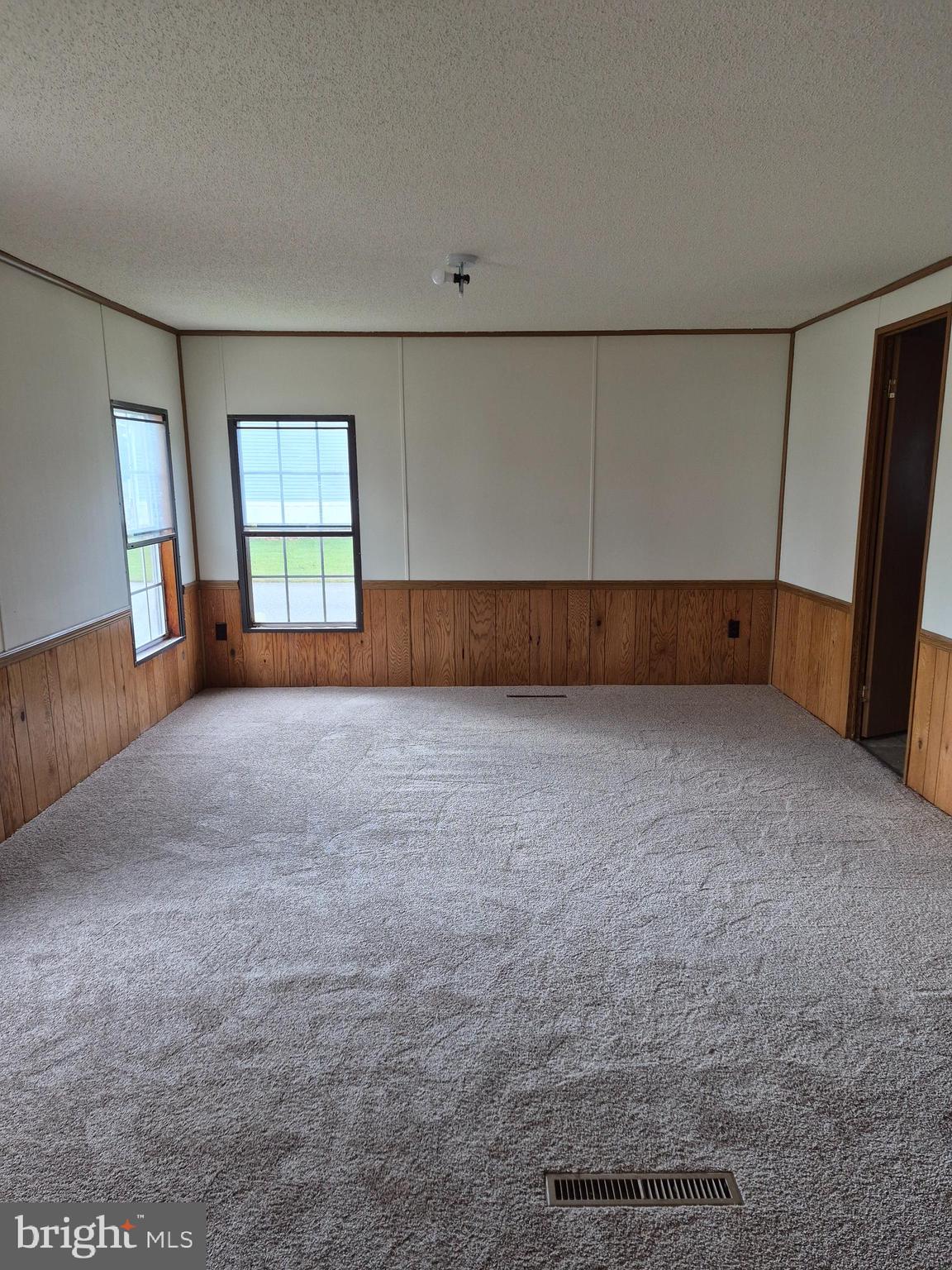 707 Cleaver Farm Road, Unit 707 Middletown, DE 19709 - Photo 8 of 15 a view of an empty room with a window