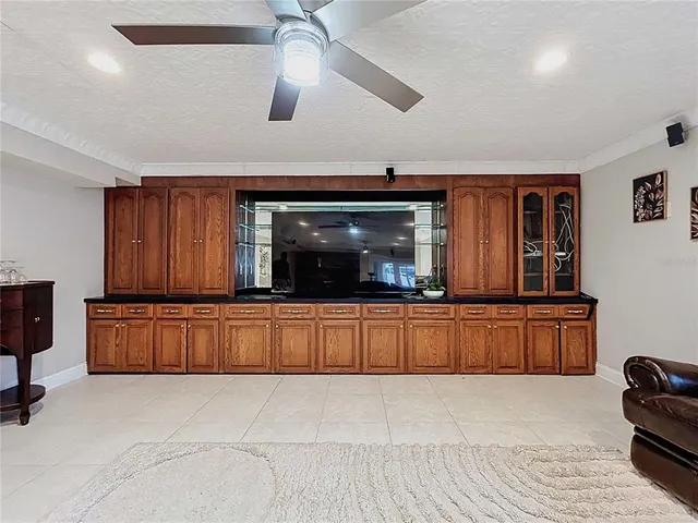 a kitchen with stainless steel appliances granite countertop a refrigerator microwave and stove top oven