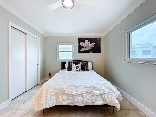 a bathroom with a granite countertop sink mirror vanity and toilet