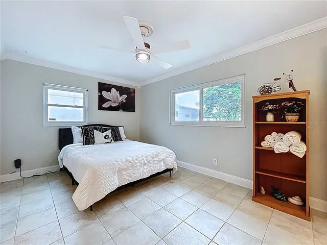 a bedroom with furniture and a table