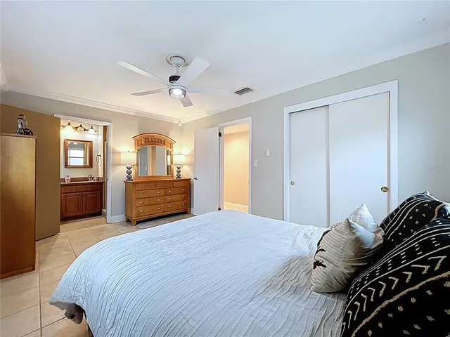 a bedroom with a bed and a table in it