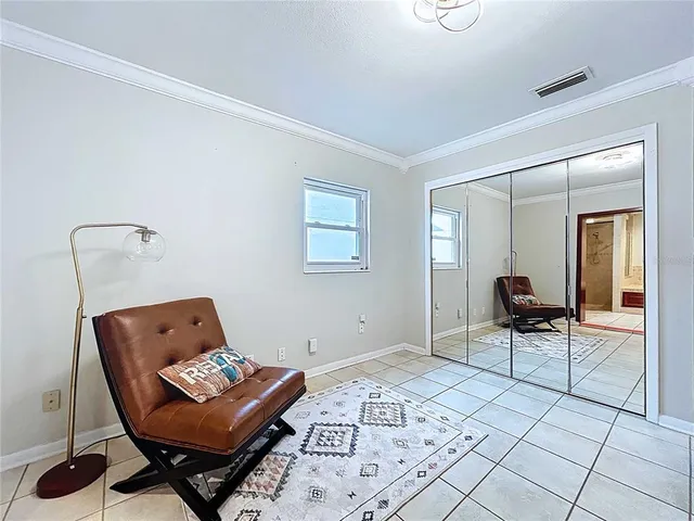 a view of a backyard with sitting area