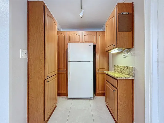 a aerial view of a house with plants and large trees