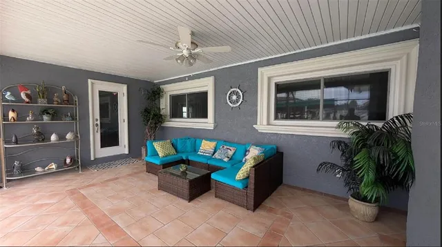 an aerial view of residential houses with outdoor space and trees