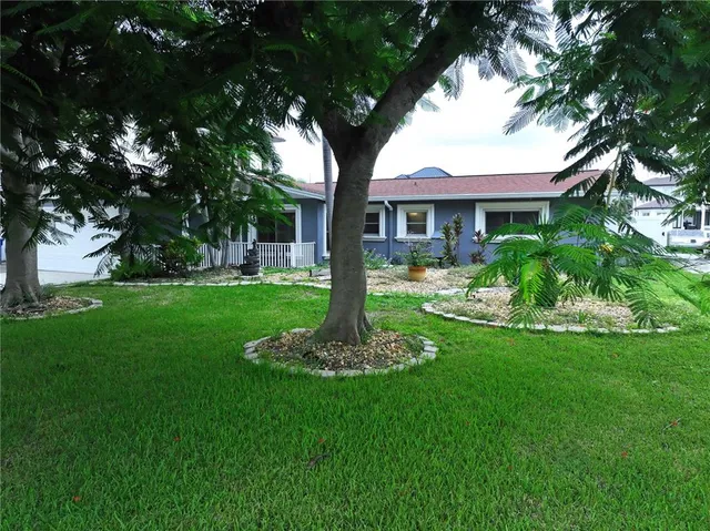 a view of a porch with wooden floor and iron stairs