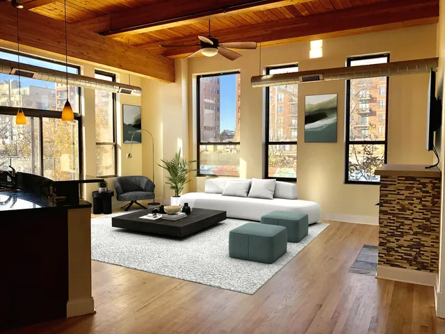 a living room with furniture window and wooden floor