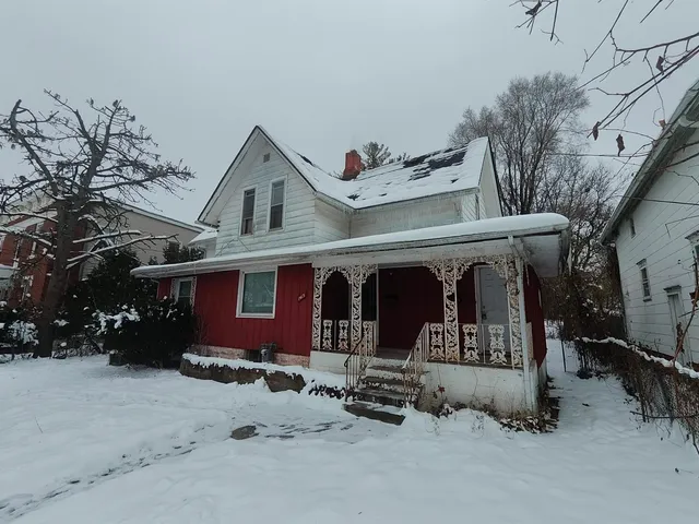 a front view of a house with garage