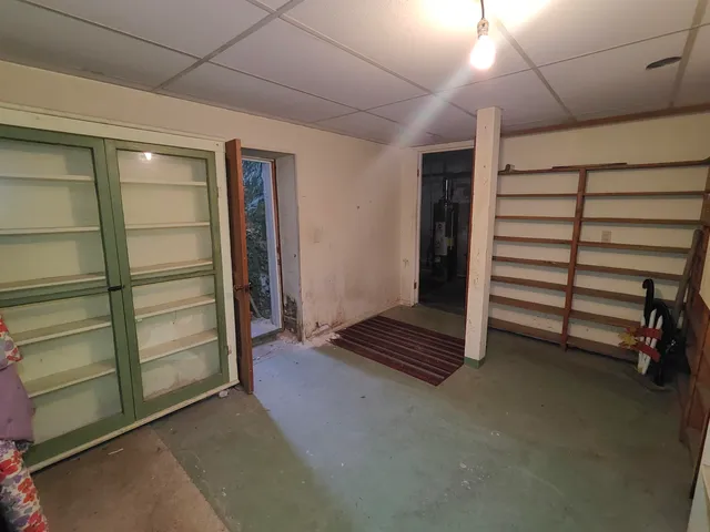 a view of an empty room and a window