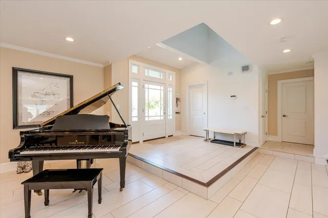 a living room with a couch and a wooden floor