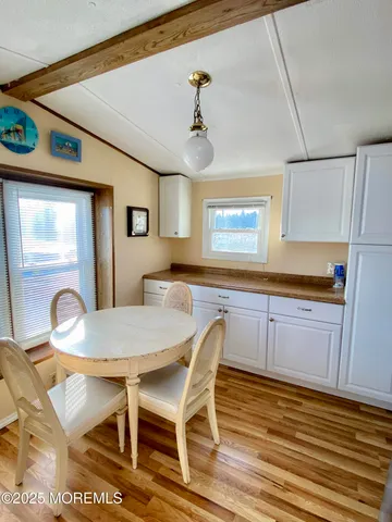 a kitchen with a sink cabinets and window