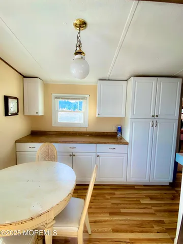 a bed sitting in a room next to a window