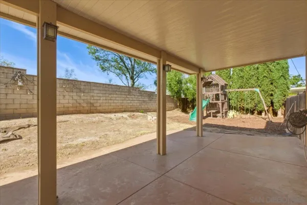 a view of a floor to ceiling window and a tree