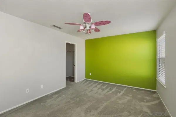 a view of a garage with a chandelier fan