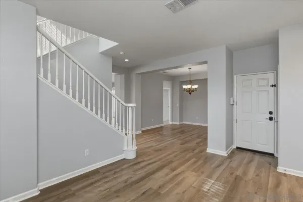 a view of entryway with wooden floor