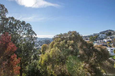 a view of a park with swings and slides
