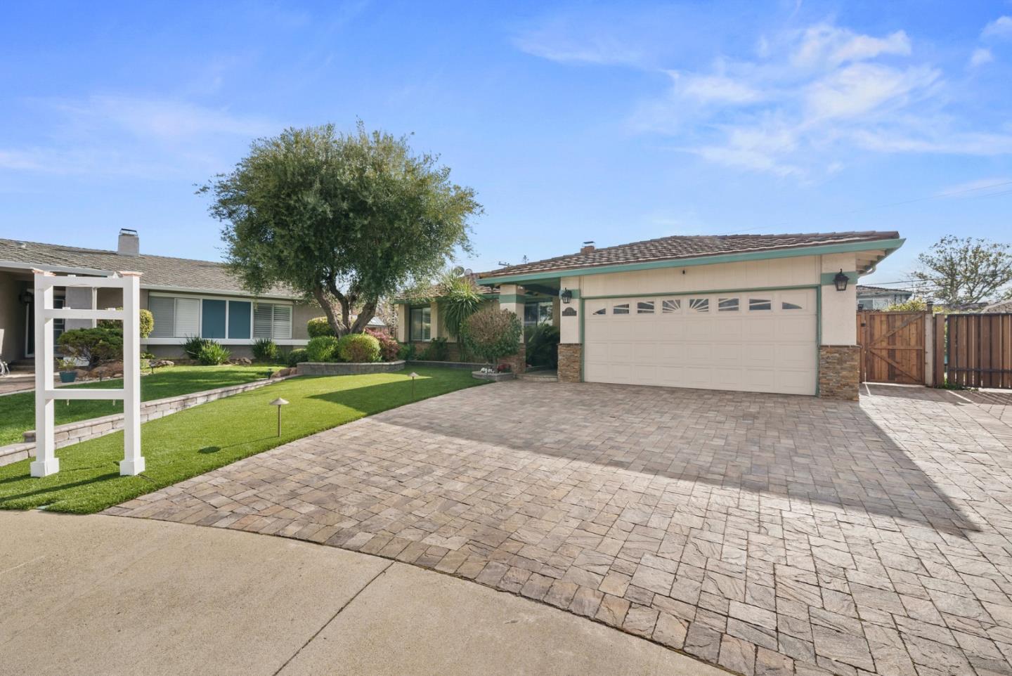 1664 Corte De Pons San Jose, CA 95124 - Photo 2 of 39 a view of a house with a yard and garage