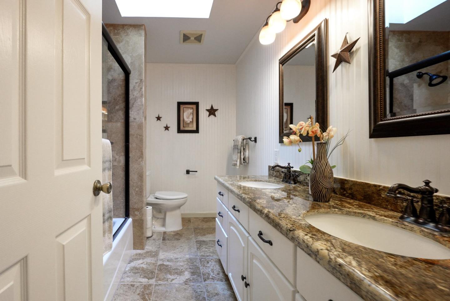 1664 Corte De Pons San Jose, CA 95124 - Photo 24 of 39 a bathroom with a granite countertop double vanity sink a mirror and a toilet