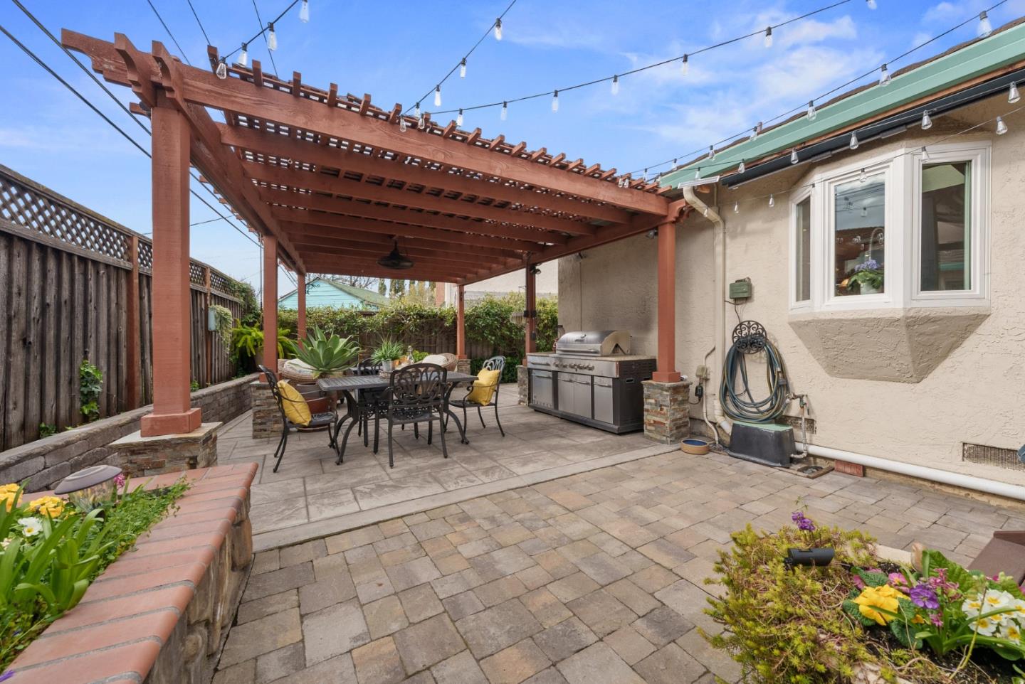 1664 Corte De Pons San Jose, CA 95124 - Photo 29 of 39 a view of a patio with table and chairs with a barbeque grill and potted plants