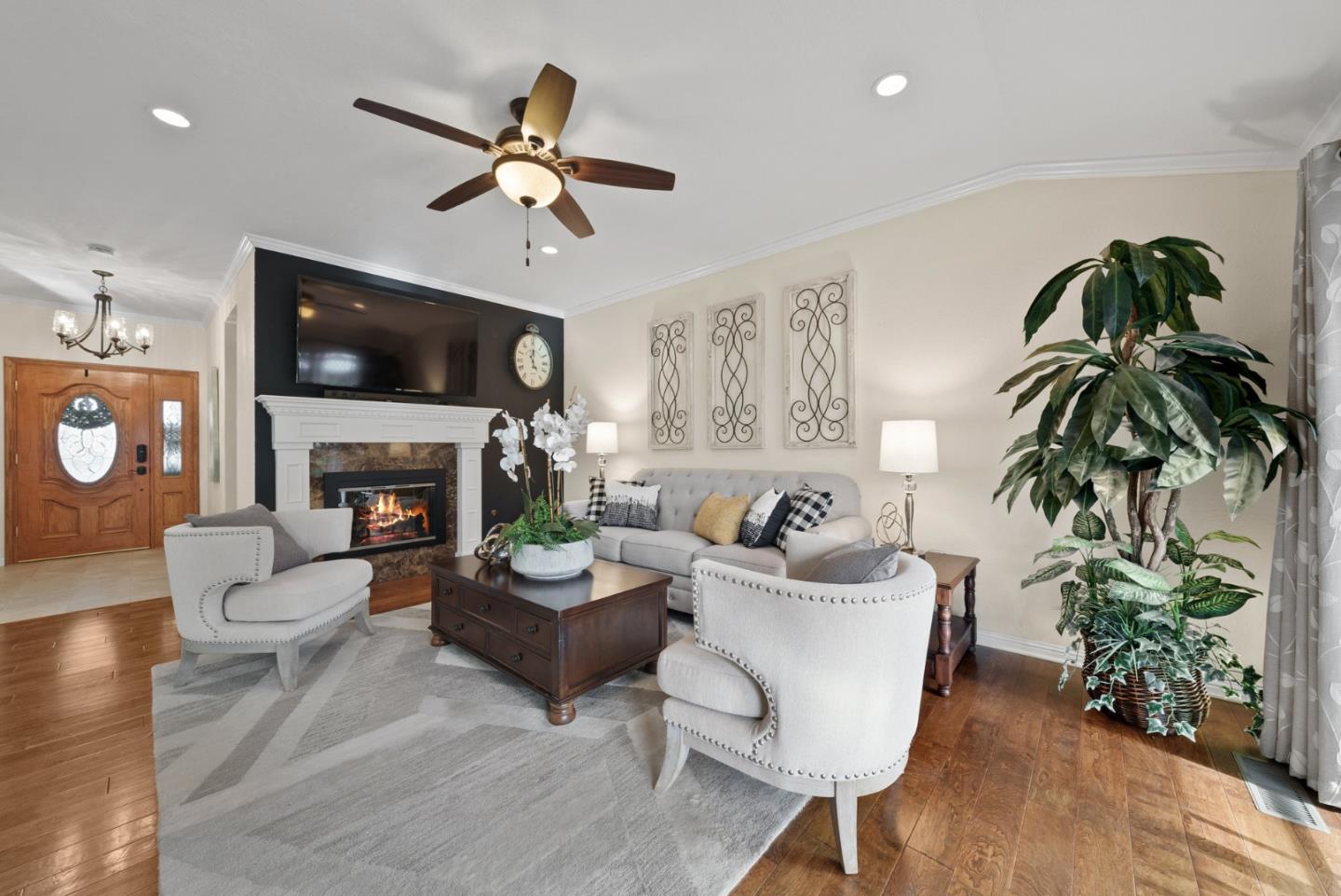 1664 Corte De Pons San Jose, CA 95124 - Photo 5 of 39 a living room with furniture a fireplace and a flat screen tv