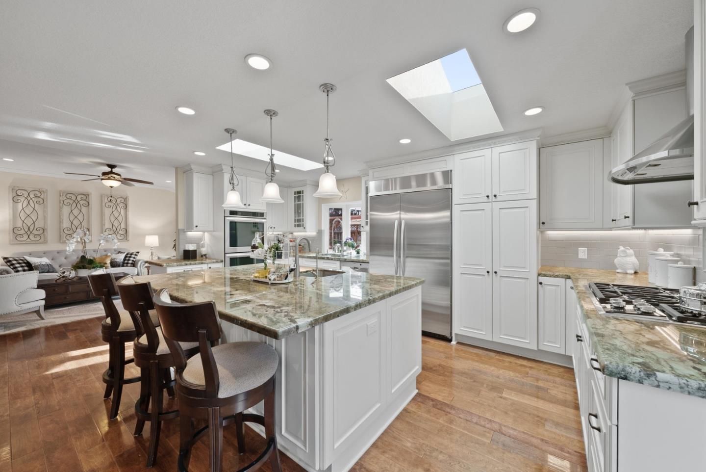 1664 Corte De Pons San Jose, CA 95124 - Photo 8 of 39 a kitchen with stainless steel appliances kitchen island granite countertop a sink and cabinets