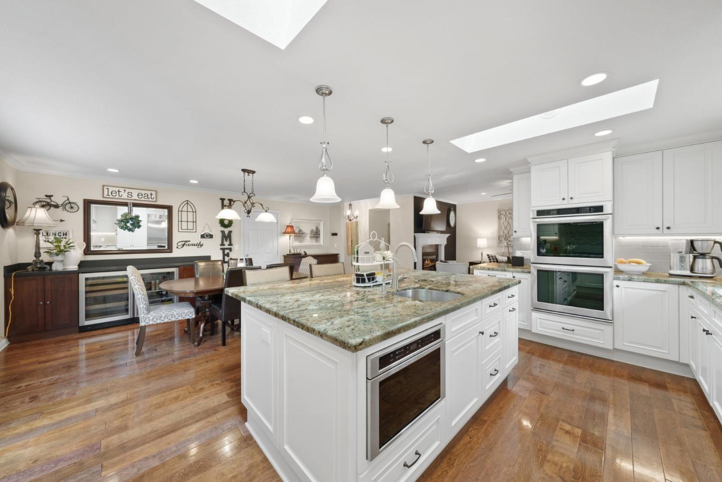 1664 Corte De Pons San Jose, CA 95124 - Photo 10 of 39 a large kitchen with kitchen island a sink table and chairs