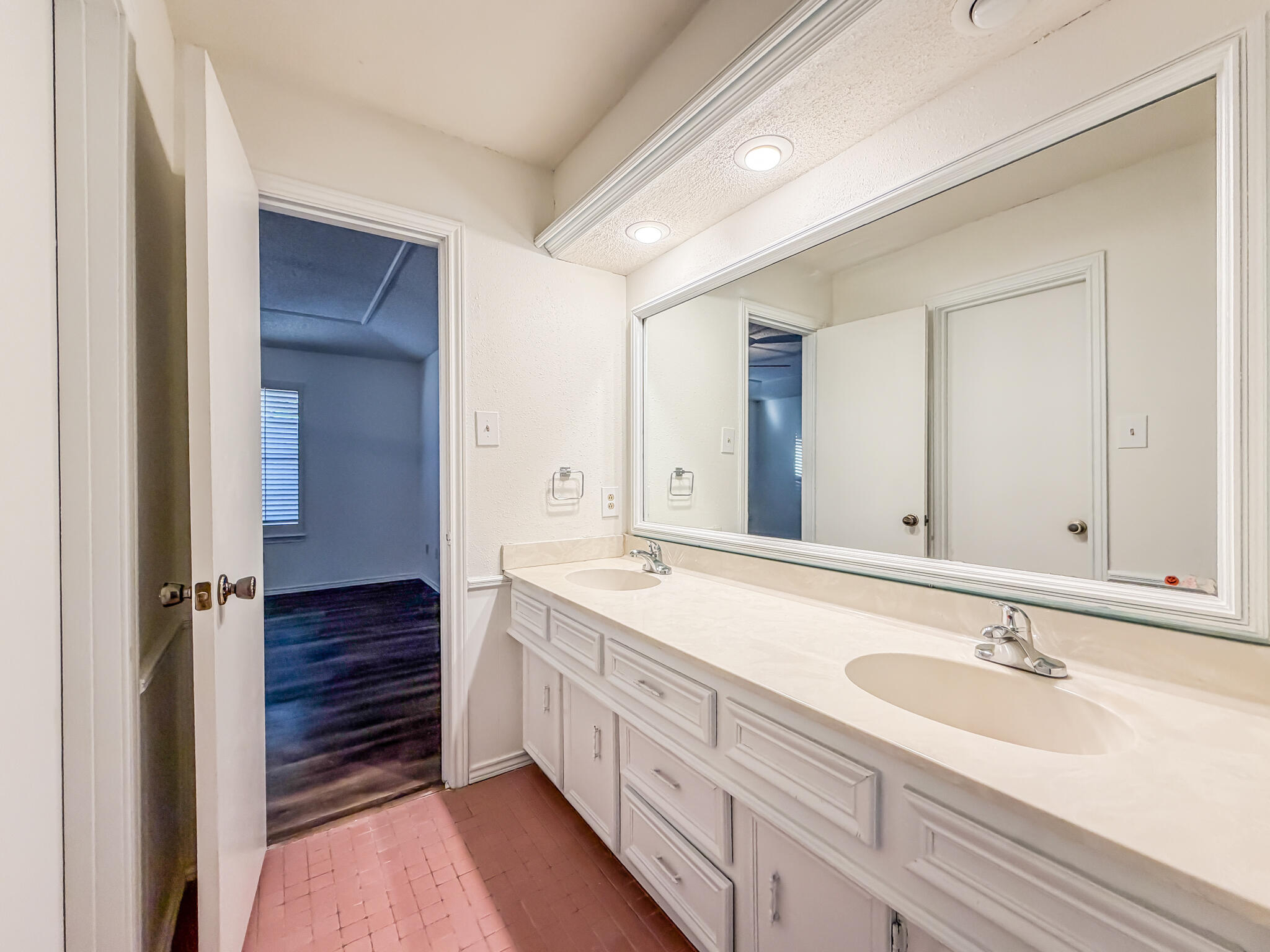3503 91st Street Lubbock, TX 79423 - Photo 15 of 23 a bathroom with a sink double vanity granite tub shower and a mirror