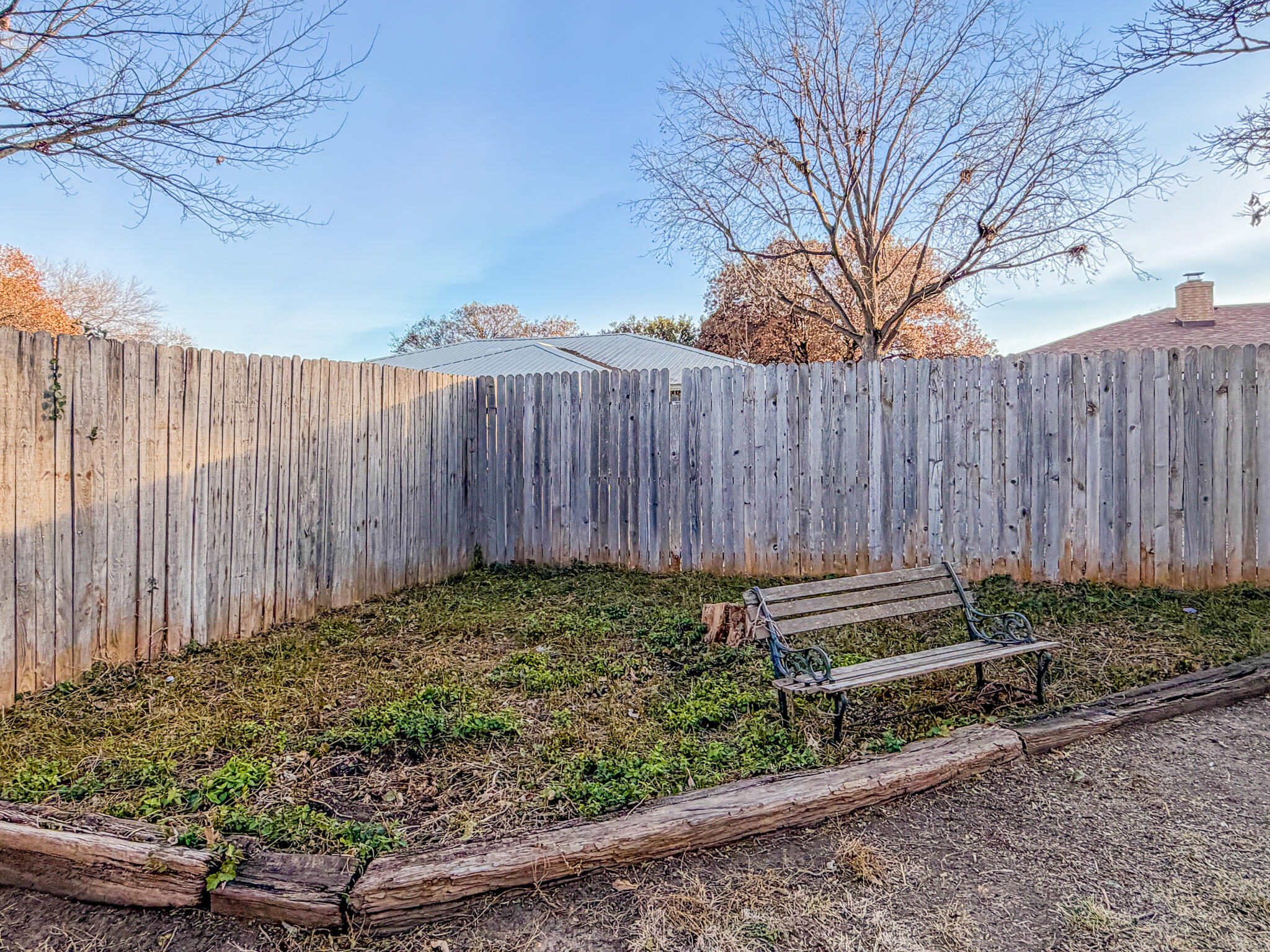 3503 91st Street Lubbock, TX 79423 - Photo 22 of 23 a view of a backyard with wooden fence