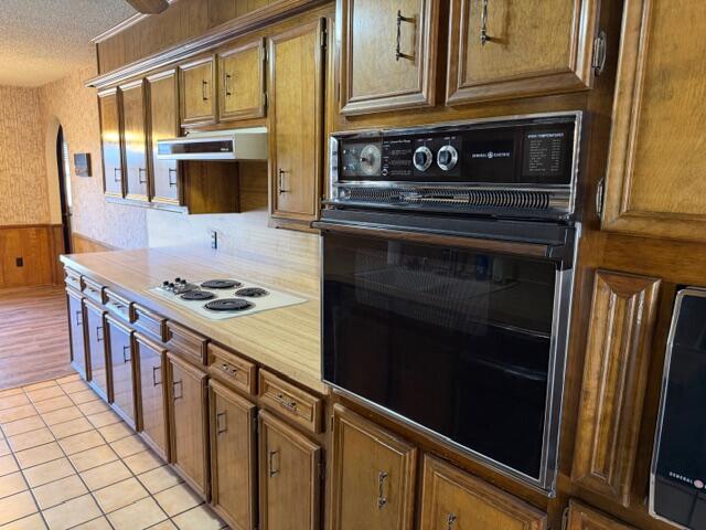 3503 91st Street Lubbock, TX 79423 - Photo 10 of 23 a kitchen with stainless steel appliances a stove and a microwave