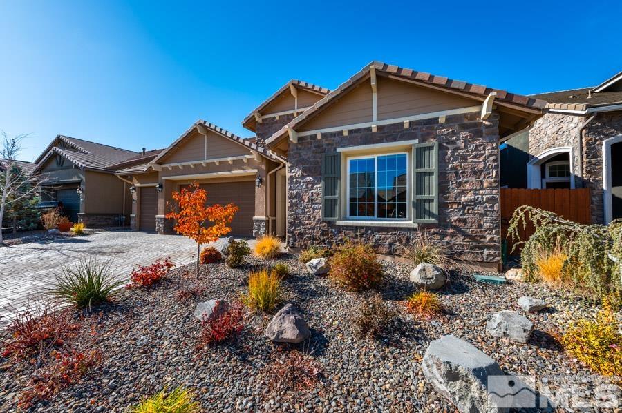 9405 Stony Hill Road Reno, NV 89521 - Photo 1 of 37 a front view of a house with garden