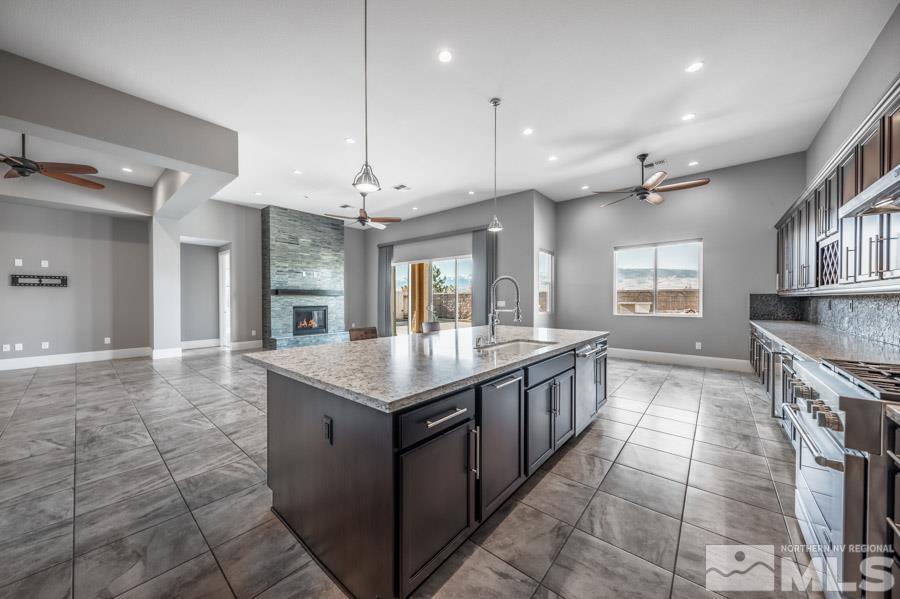 9405 Stony Hill Road Reno, NV 89521 - Photo 11 of 37 a large kitchen with a stove and a sink