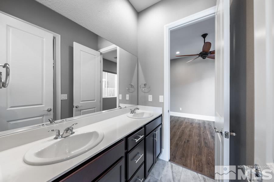 9405 Stony Hill Road Reno, NV 89521 - Photo 25 of 37 a bathroom with a sink and a mirror