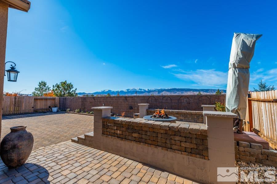 9405 Stony Hill Road Reno, NV 89521 - Photo 29 of 37 a view of a balcony with chairs and wooden floor