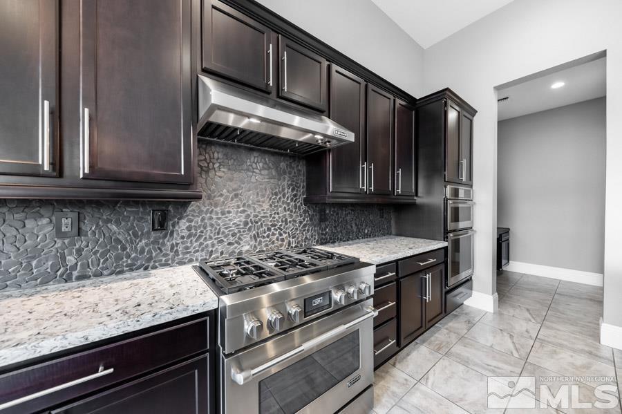 9405 Stony Hill Road Reno, NV 89521 - Photo 10 of 37 a kitchen with stainless steel appliances granite countertop a stove and a sink