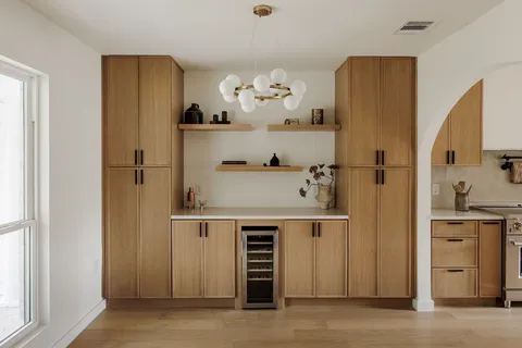 a view of kitchen with cabinets and wooden floor