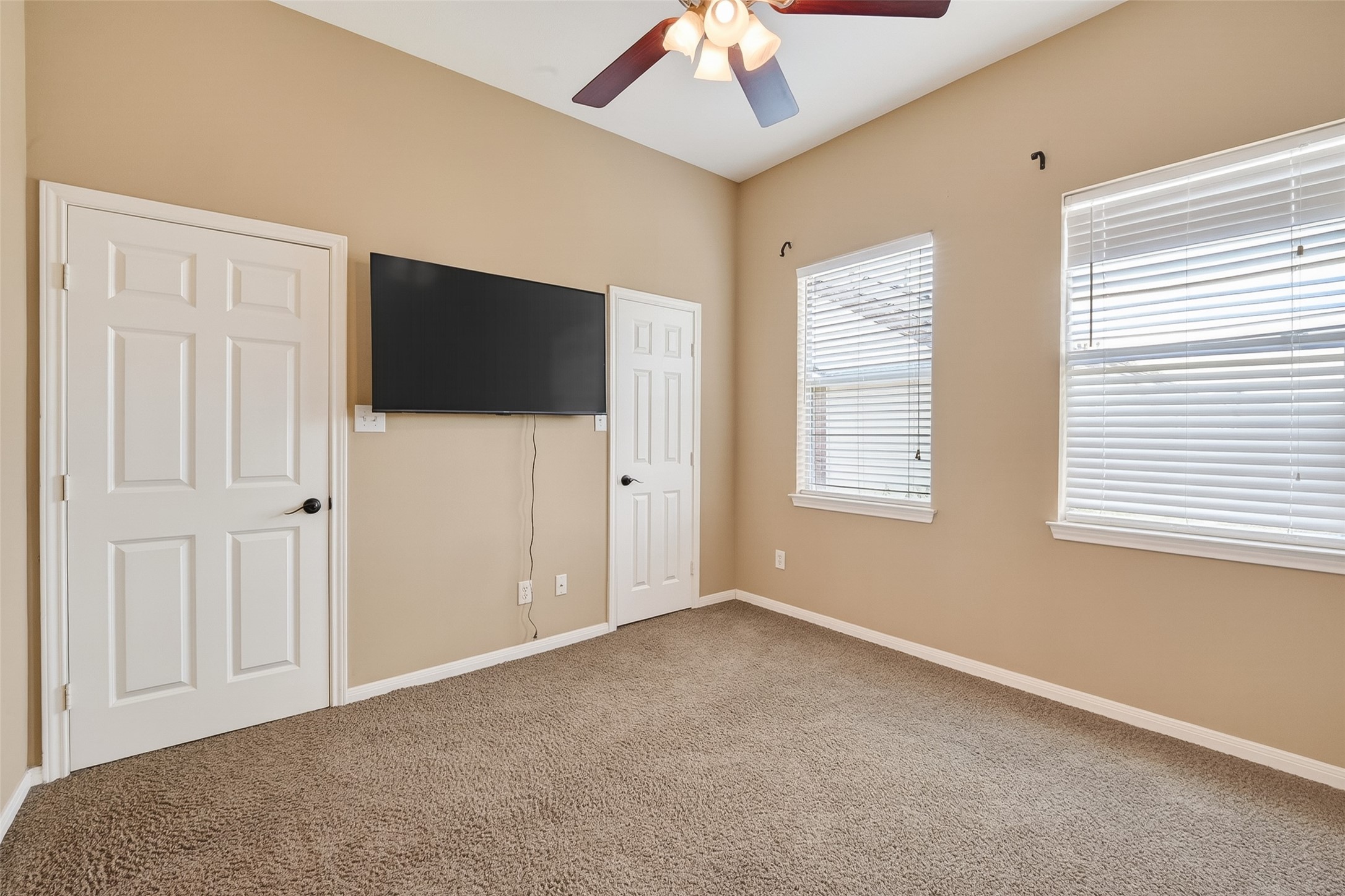 2804 Chenevert Street Houston, TX 77004 - Photo 27 of 37 an empty room with windows and fan