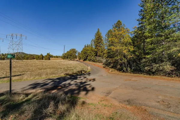 a view of a road with a building in the background