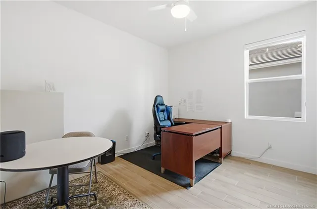 a bathroom with a sink toilet a mirror and shower
