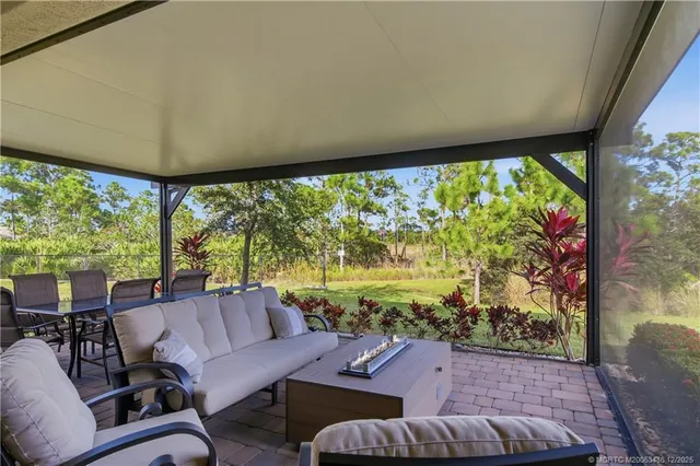 a view of a chairs and tables in the patio